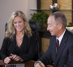 Two attorneys reviewing computer